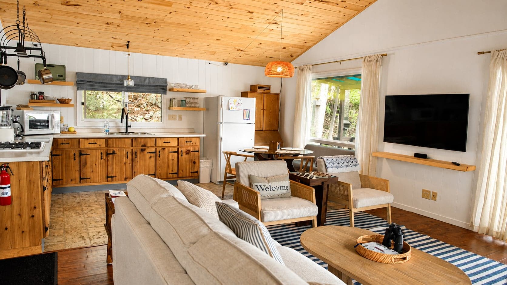 The bright open kitchen and living room inside Birch Island Cottage